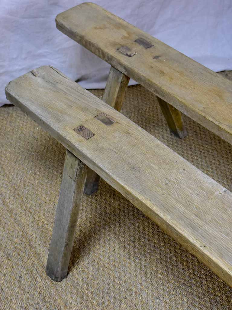 Pair of rustic antique French benches with splayed feet