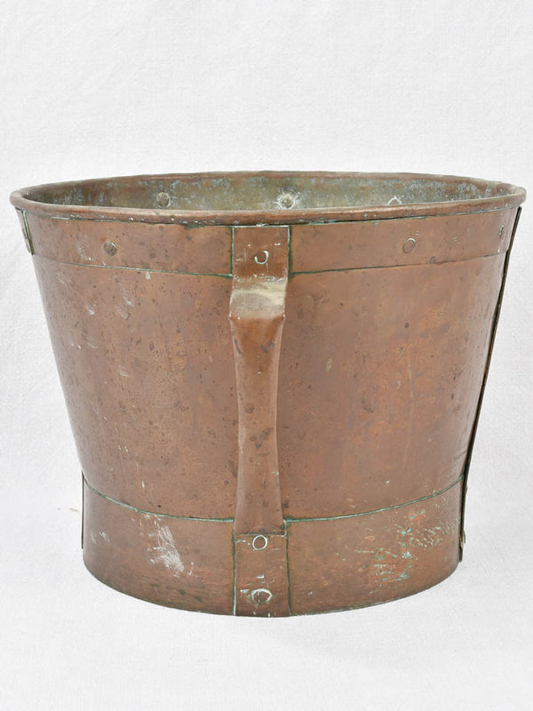 Historical copper grain measuring container