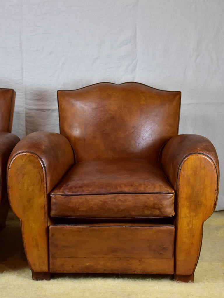 Pair of large mustache back vintage French club chairs