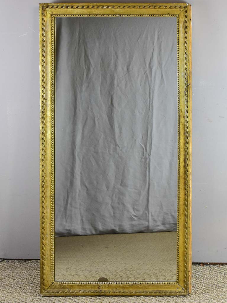 Early 19th Century French mirror with fatigued gold frame