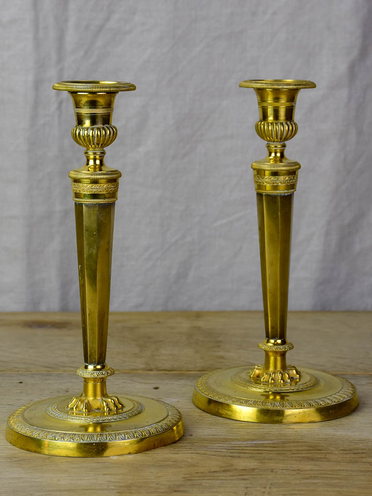 Pair of early 19th Century bronze candlesticks with claw feet