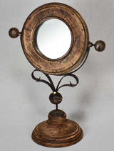 Small round tilting vanity mirror