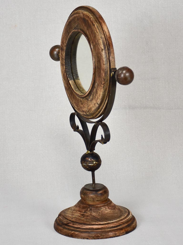 Small round tilting vanity mirror