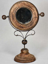 Small round tilting vanity mirror