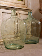 Pair of antique demijohn bottles