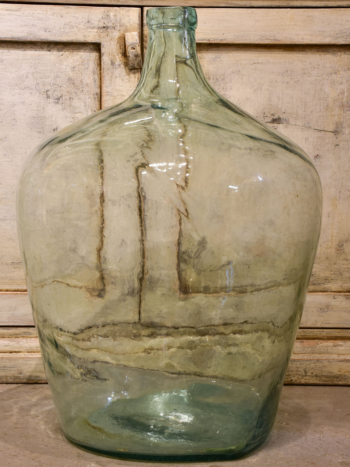 Pair of antique demijohn bottles
