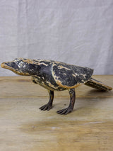 Rustic wooden sculpture of a raven - folk art