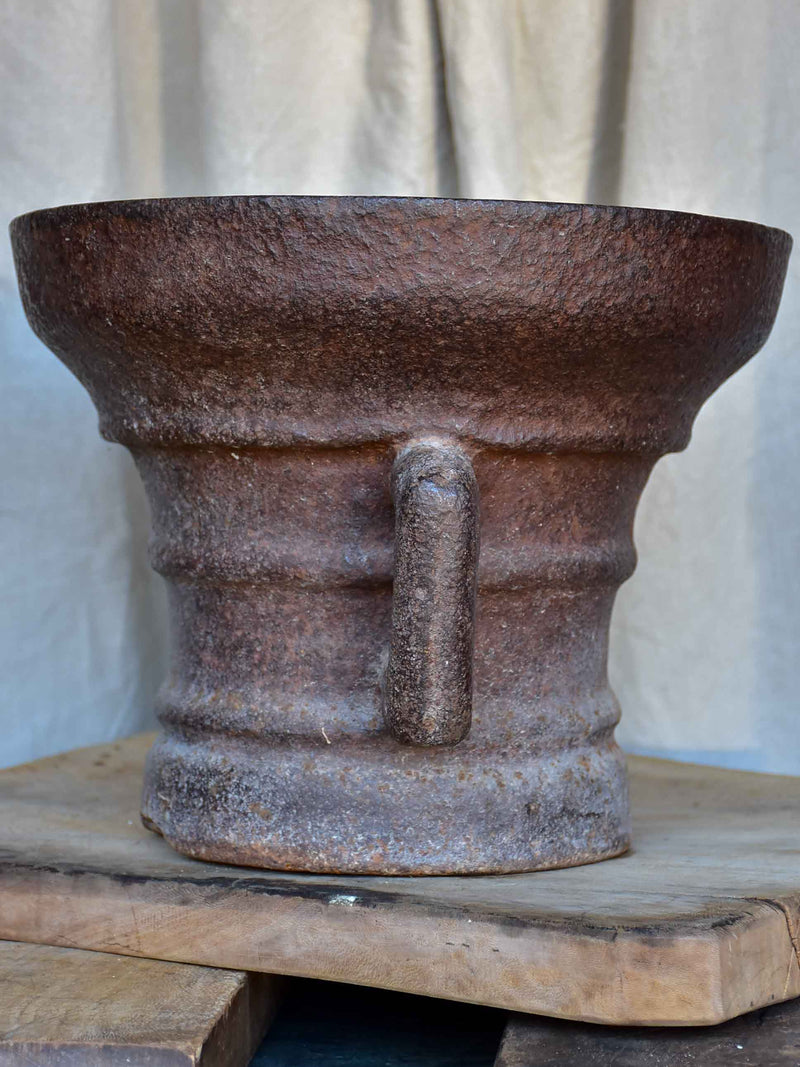 Antique iron mortar with bracket arms - European