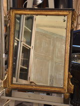 Antique Louis XVI style mirror with black & gilt wood frame