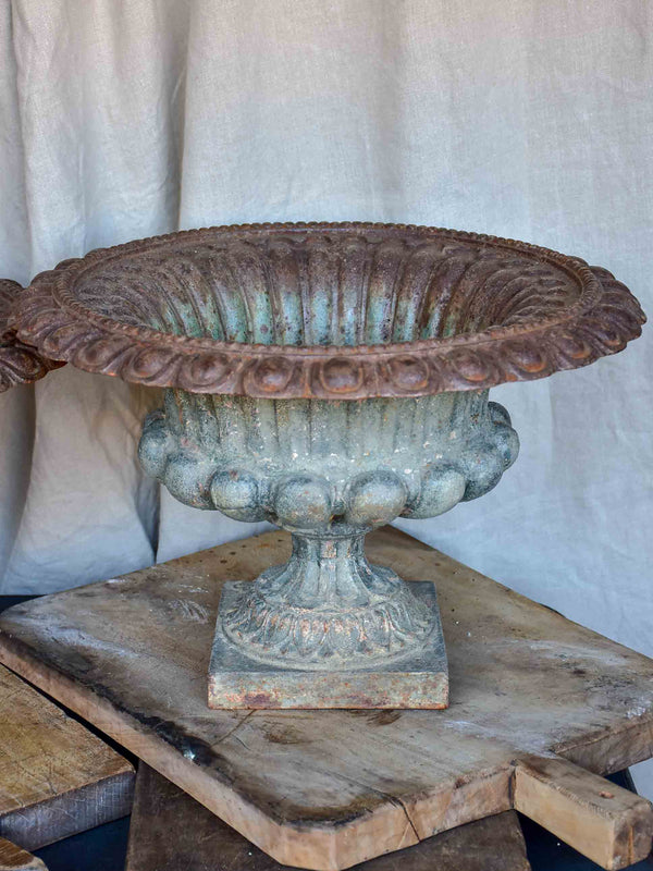 Pair of antique French cast iron urns