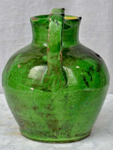 Antique French water jug with green glaze and spout