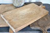 Very large antique French cutting board with fishtail handle