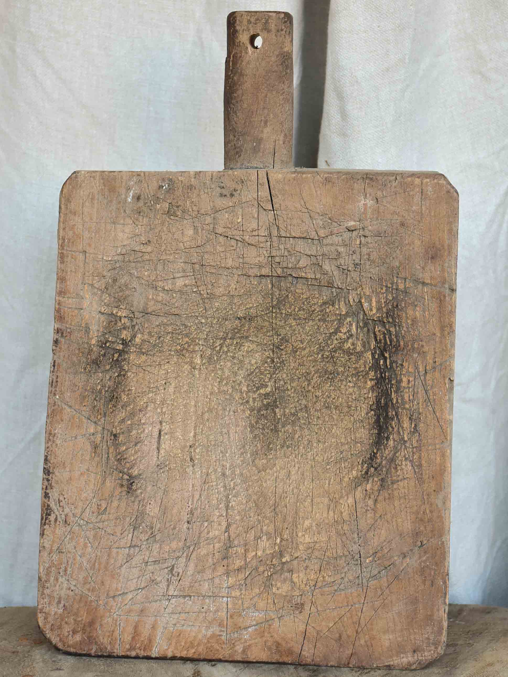 Antique French cutting board with worn surface 15 ¼''
