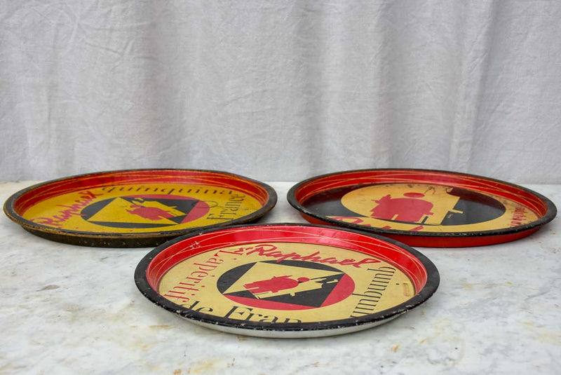 Collection of four round bistro trays - Quinquina