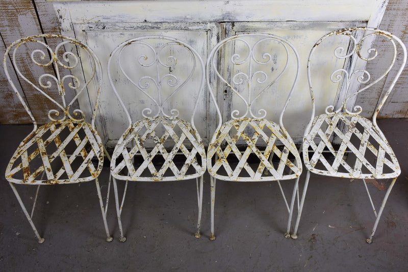 Four antique French garden chairs