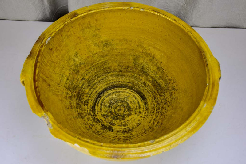 Large antique Spanish bowl with yellow glaze