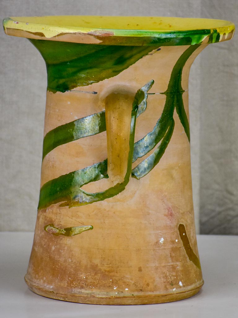 Antique Spanish pot with yellow and green glaze.