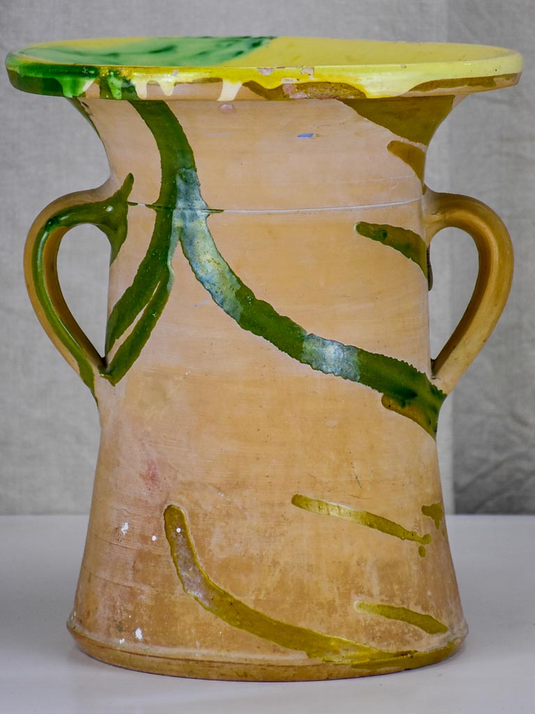 Antique Spanish pot with yellow and green glaze.