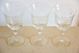 Set of eight vintage red wine glasses with decorative etchings