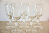 Set of eight vintage red wine glasses with decorative etchings
