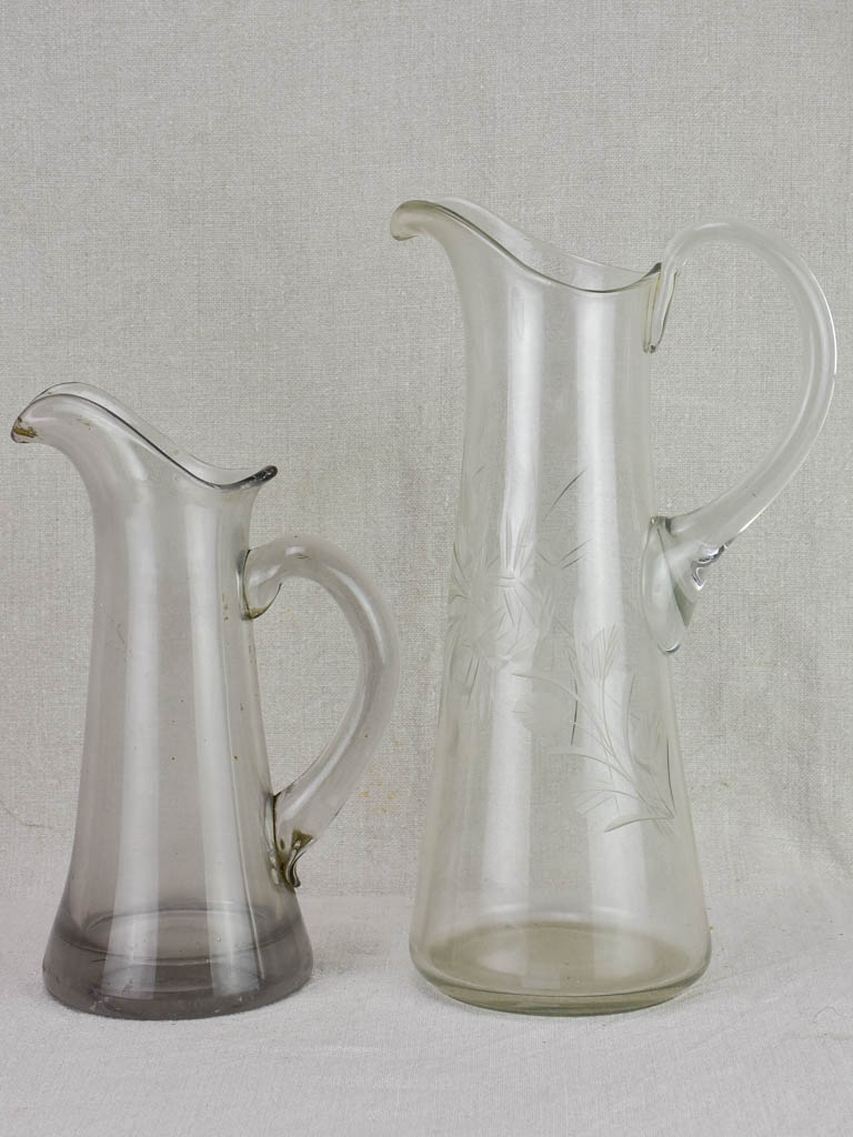 Two blown glass bistro cider pitchers
