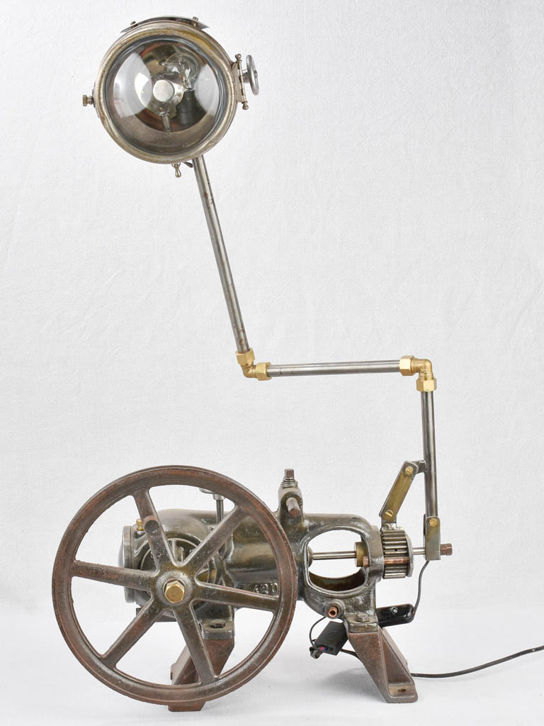 Salvaged pump and motorbike table lamp