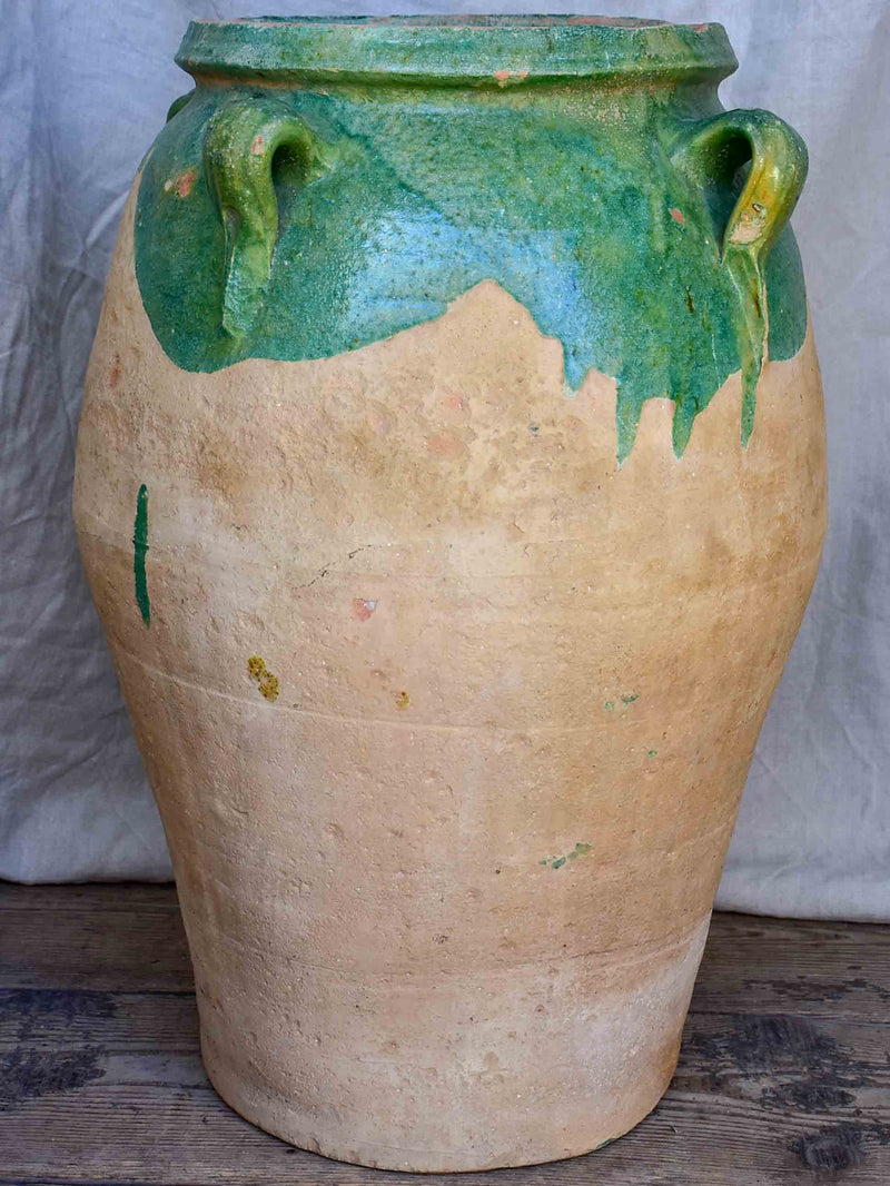 Antique French amphora pot with green glaze and four handles