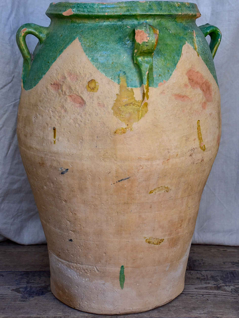 Antique French amphora pot with green glaze and four handles