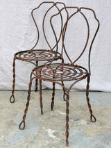Pair of pretty black antique French garden chairs branded Vachon