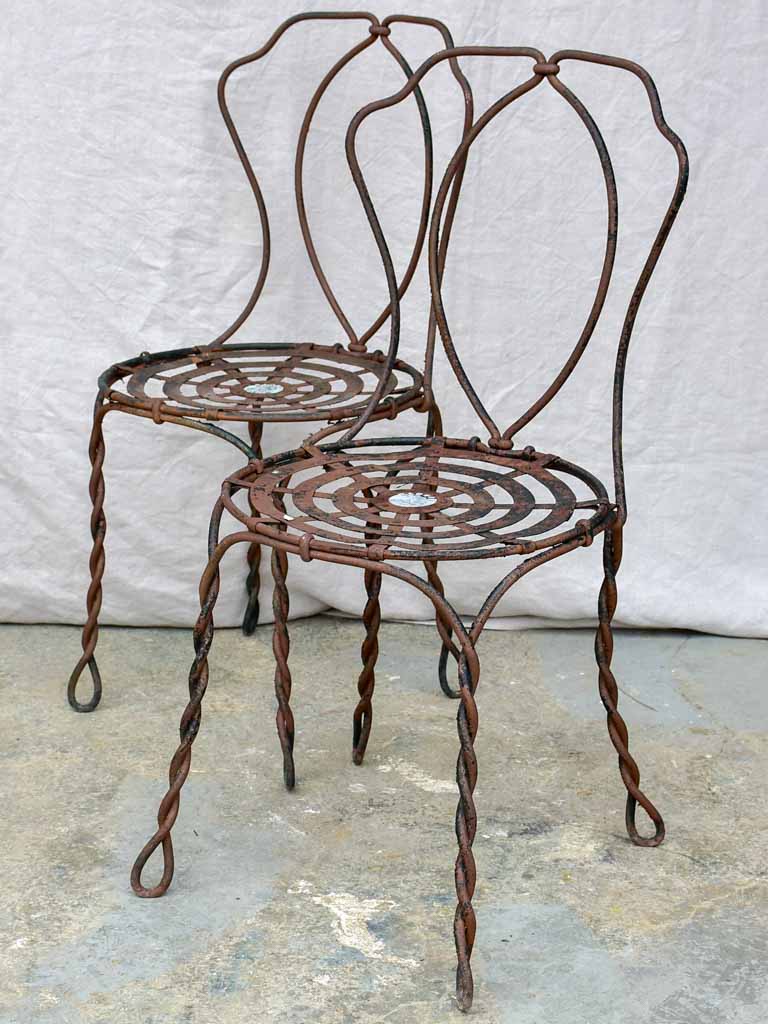 Pair of pretty black antique French garden chairs branded Vachon