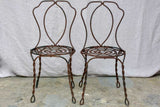 Pair of pretty black antique French garden chairs branded Vachon