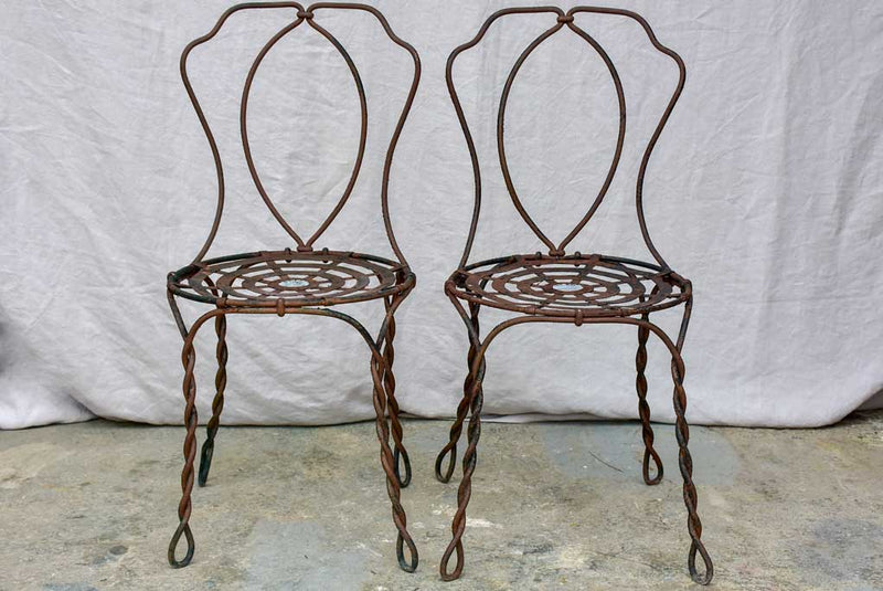 Pair of pretty black antique French garden chairs branded Vachon