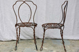 Pair of pretty black antique French garden chairs branded Vachon