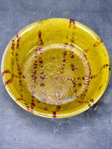 Antique French clay bowl with spotted glaze