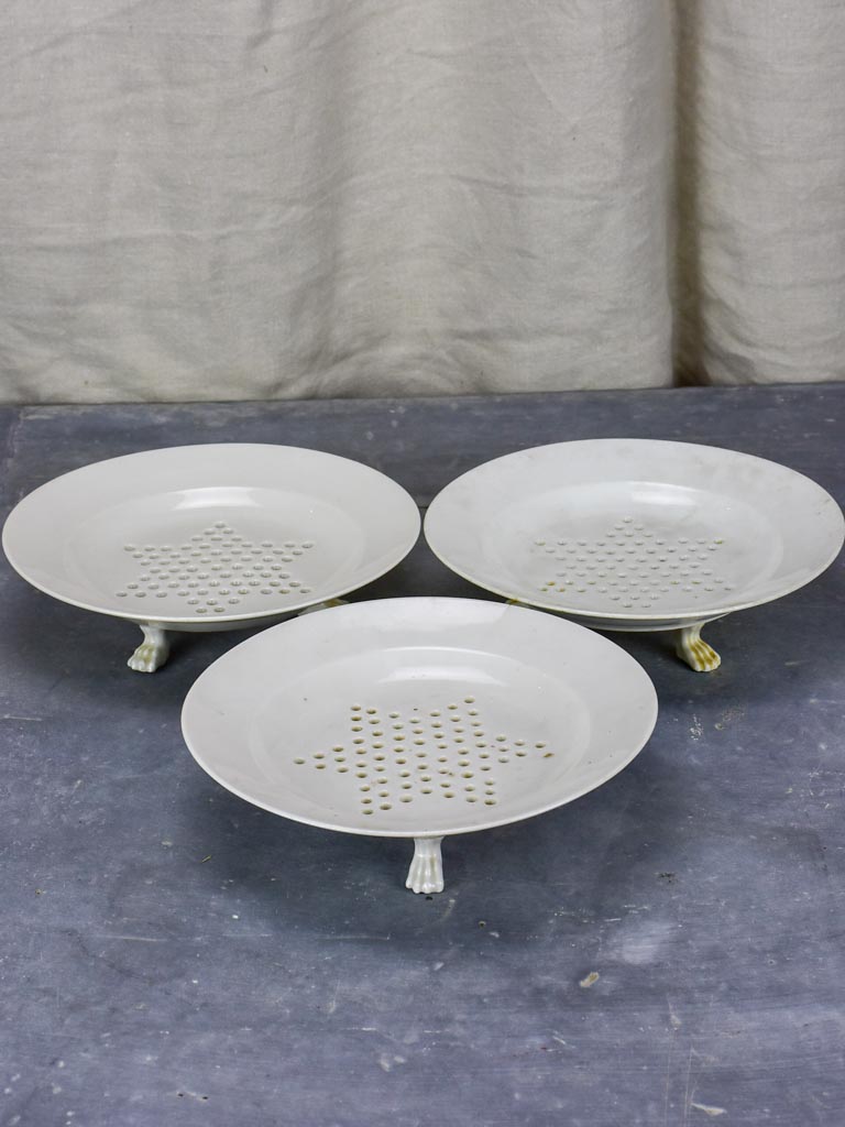 Set of three Directoire fruit strainer plates with claw feet