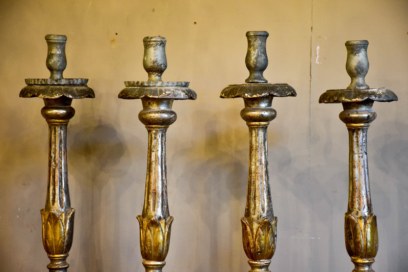 Four large antique Italian church candlesticks