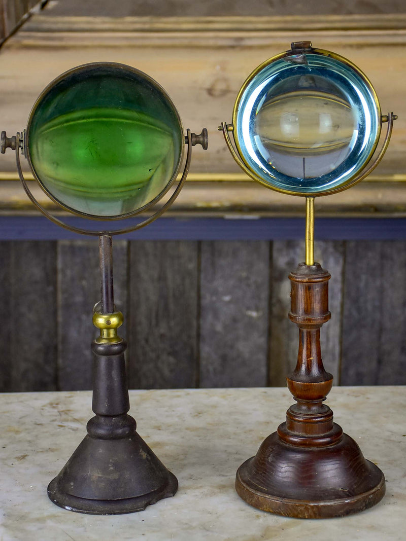 Pair of antique French magnifying loupes on stands