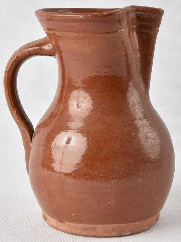 1970s terracotta pitcher w/ brown glaze 9½"