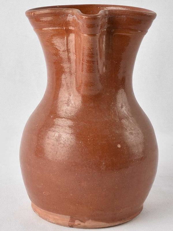 1970s terracotta pitcher w/ brown glaze 9½"