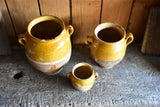 Three antique French confit pots with orange glaze