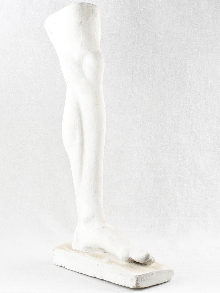 Artistic plaster sculpture of human leg