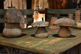 Three wooden French sculptures in the shape of mushrooms