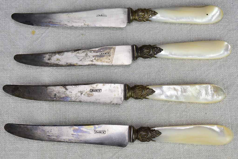 Set of 12 antique Parisian knives with mother of pearl handles and carbon steel blades