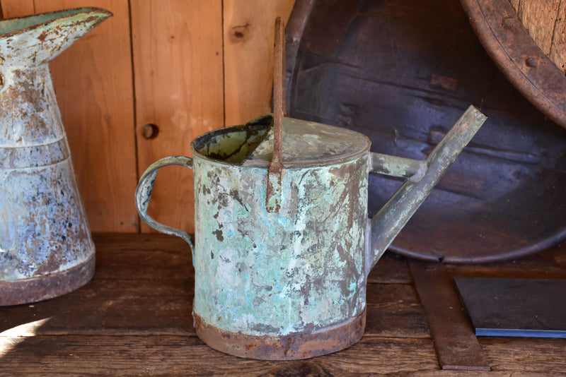 Antique French watering can with blue / green patina