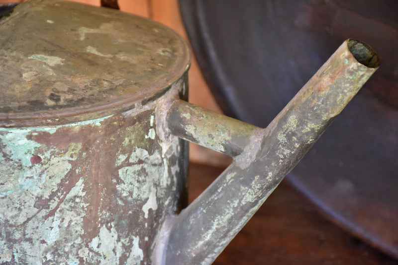 Antique French watering can with blue / green patina