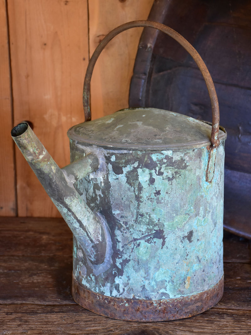 Antique French watering can with blue / green patina