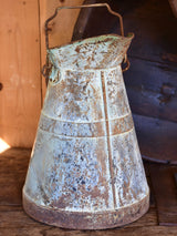 Antique French watering can with aqua patina