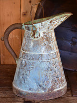 Antique French watering can with aqua patina