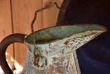 Antique French watering can with aqua patina