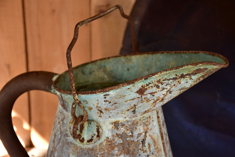 Antique French watering can with aqua patina
